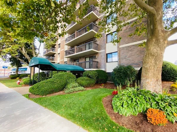 a view of a building with a yard