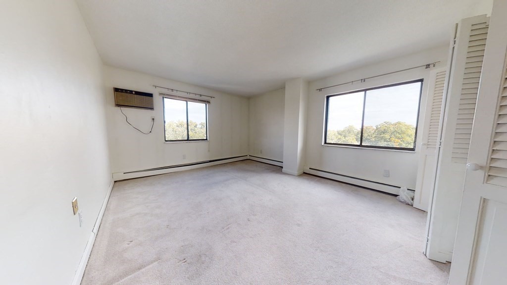 164 Galen Street, Unit 65 Watertown, MA 02472 - Photo 9 of 13 an empty room with windows