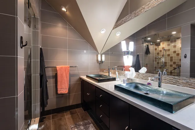 a view of a patio with chairs and table under an umbrella