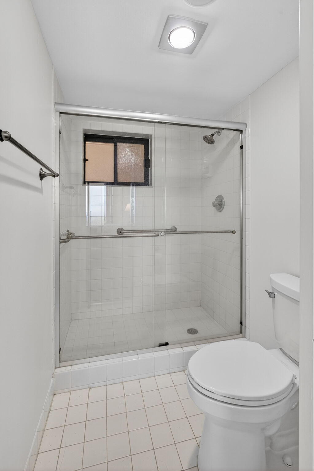 100 Ocean Trail Way, Unit 305 Jupiter, FL 33477 - Photo 13 of 53 a bathroom with a toilet a sink and shower