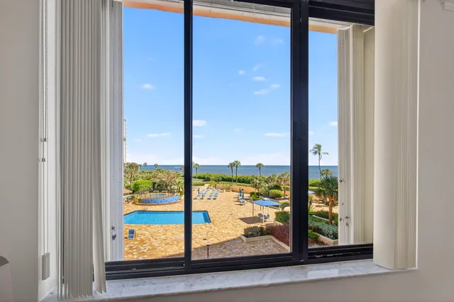 a view of a glass door and porch