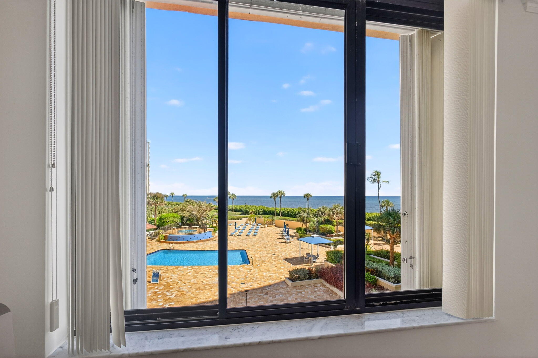 100 Ocean Trail Way, Unit 305 Jupiter, FL 33477 - Photo 17 of 53 a view of a glass door and porch