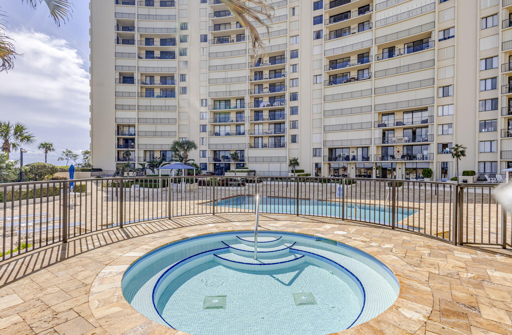 100 Ocean Trail Way, Unit 305 Jupiter, FL 33477 - Photo 42 of 53 a swimming pool with view of building