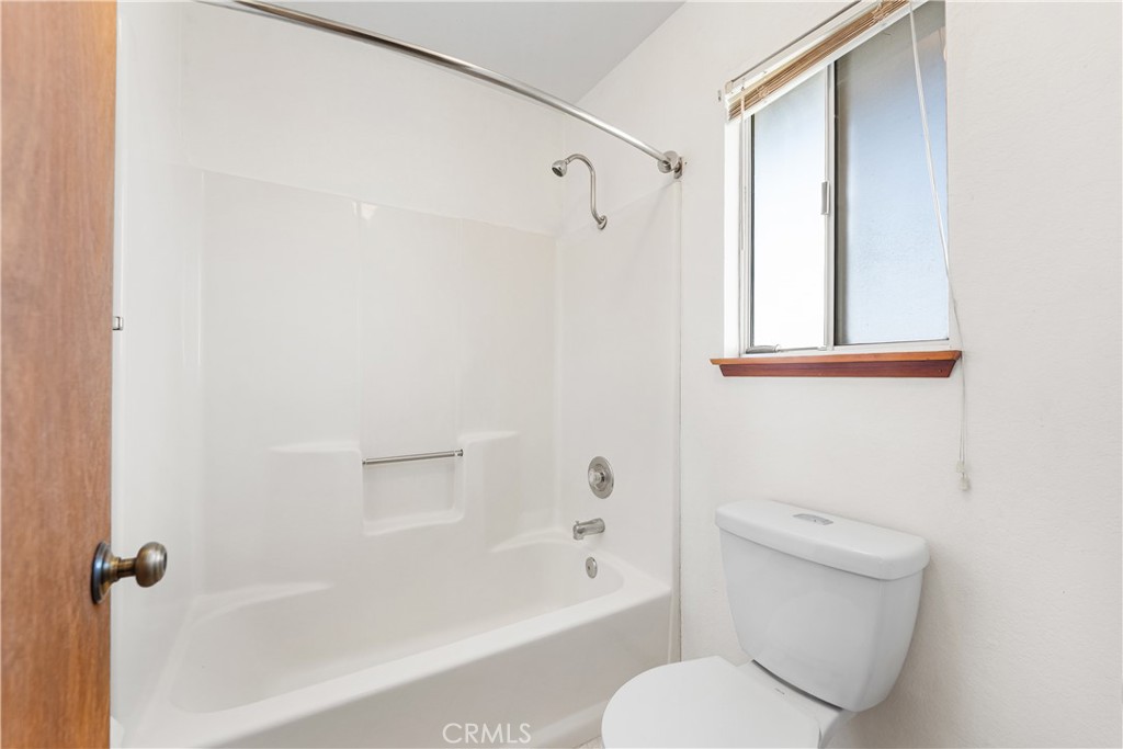 10837 East Ave R 10 Littlerock, CA 93543 - Photo 27 of 50 a bathroom with a toilet and a bathtub