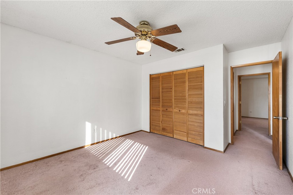 10837 East Ave R 10 Littlerock, CA 93543 - Photo 29 of 50 an empty room with closet and windows