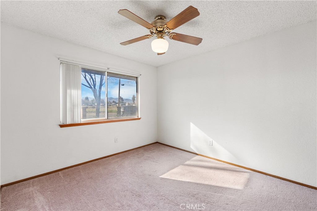 10837 East Ave R 10 Littlerock, CA 93543 - Photo 32 of 50 an empty room with windows and fan