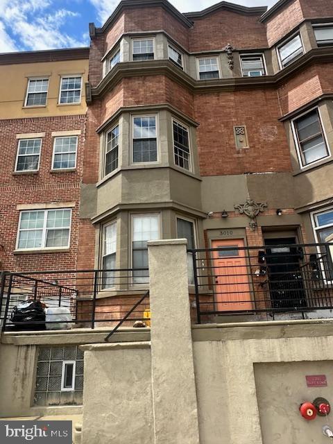 a front view of a building with glass windows