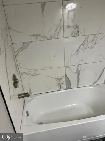 a bathroom with a bathtub