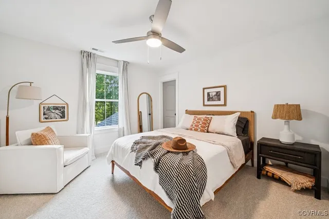 a bedroom with a bed and a couch