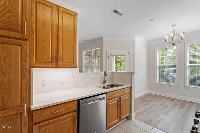a kitchen that has a sink and a window