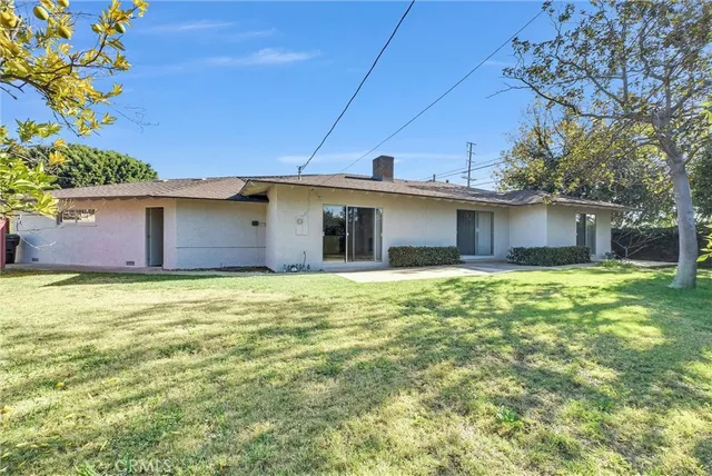 a outdoor view of a house with a garden