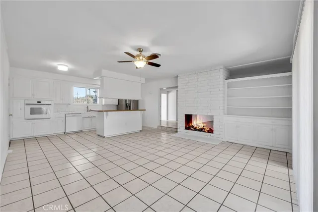 a view of a kitchen with furniture and a fireplace