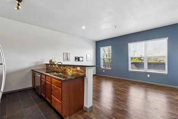 a kitchen with stainless steel appliances granite countertop a stove and a sink