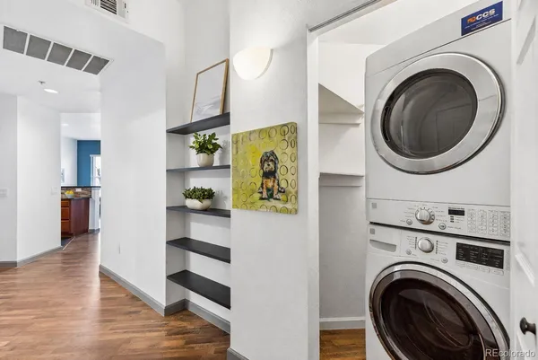 a view of a hallway with washer and dryer