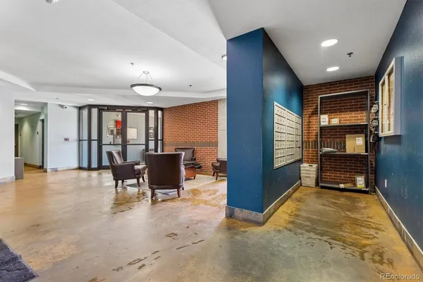 a view of a room with furniture and window