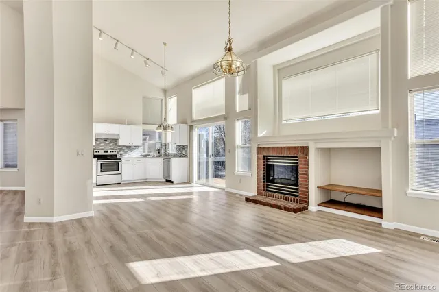 a view of a kitchen with furniture and a fireplace