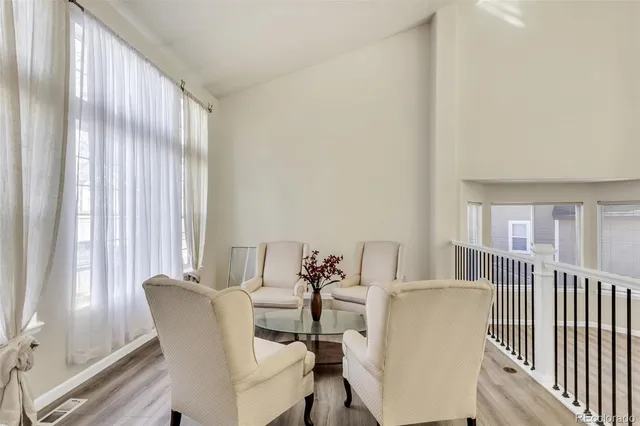 a view of a dining room with furniture and a window
