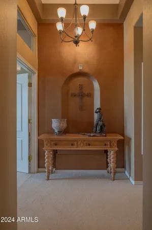 a view of hall way with furniture