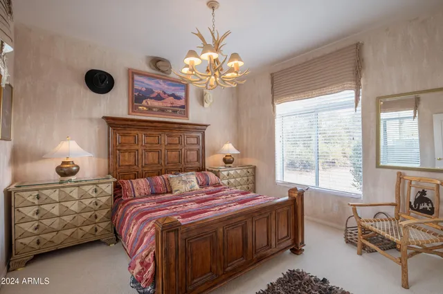 a bedroom with bed and a window