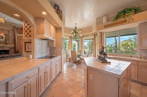 a view of a swimming pool with a patio and a yard