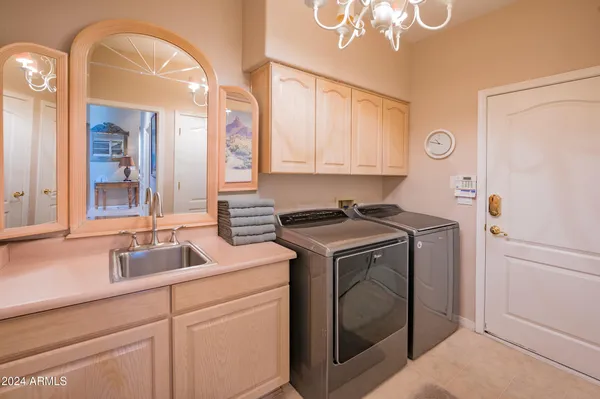 a view of a house with swimming pool and sitting area