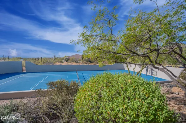 a large bathroom with a large tub and sink