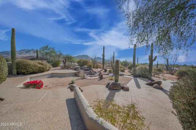 a large bathroom with a large tub and sink