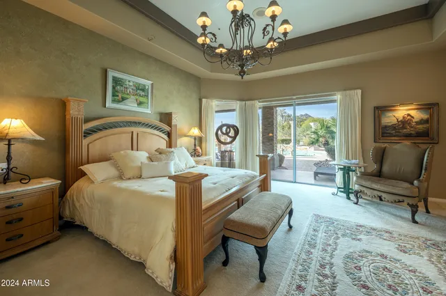 a view of a backyard with plants and outdoor seating