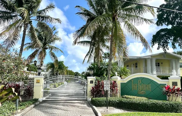 a front view of a house with fountain and entertaining space