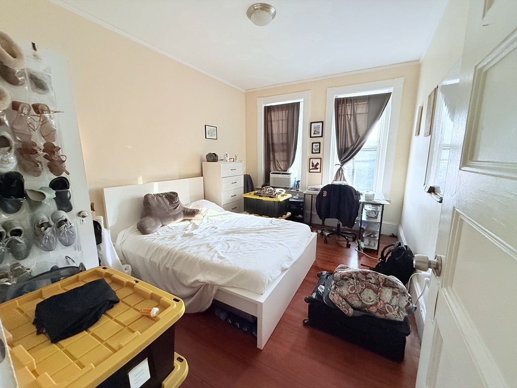 220-224 Washington Street, Unit 7A Brookline, MA 02445 - Photo 7 of 9 a bedroom with bed and a window