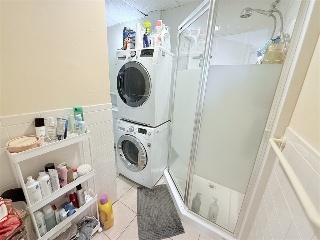 220-224 Washington Street, Unit 7A Brookline, MA 02445 - Photo 8 of 9 a utility room with dryer and washer