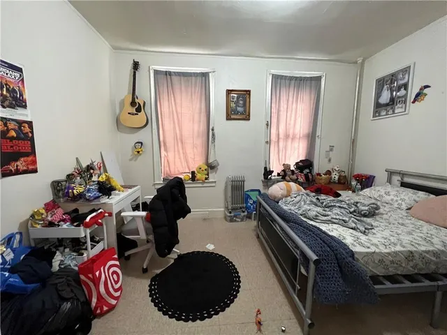 a bathroom with a tub and a window