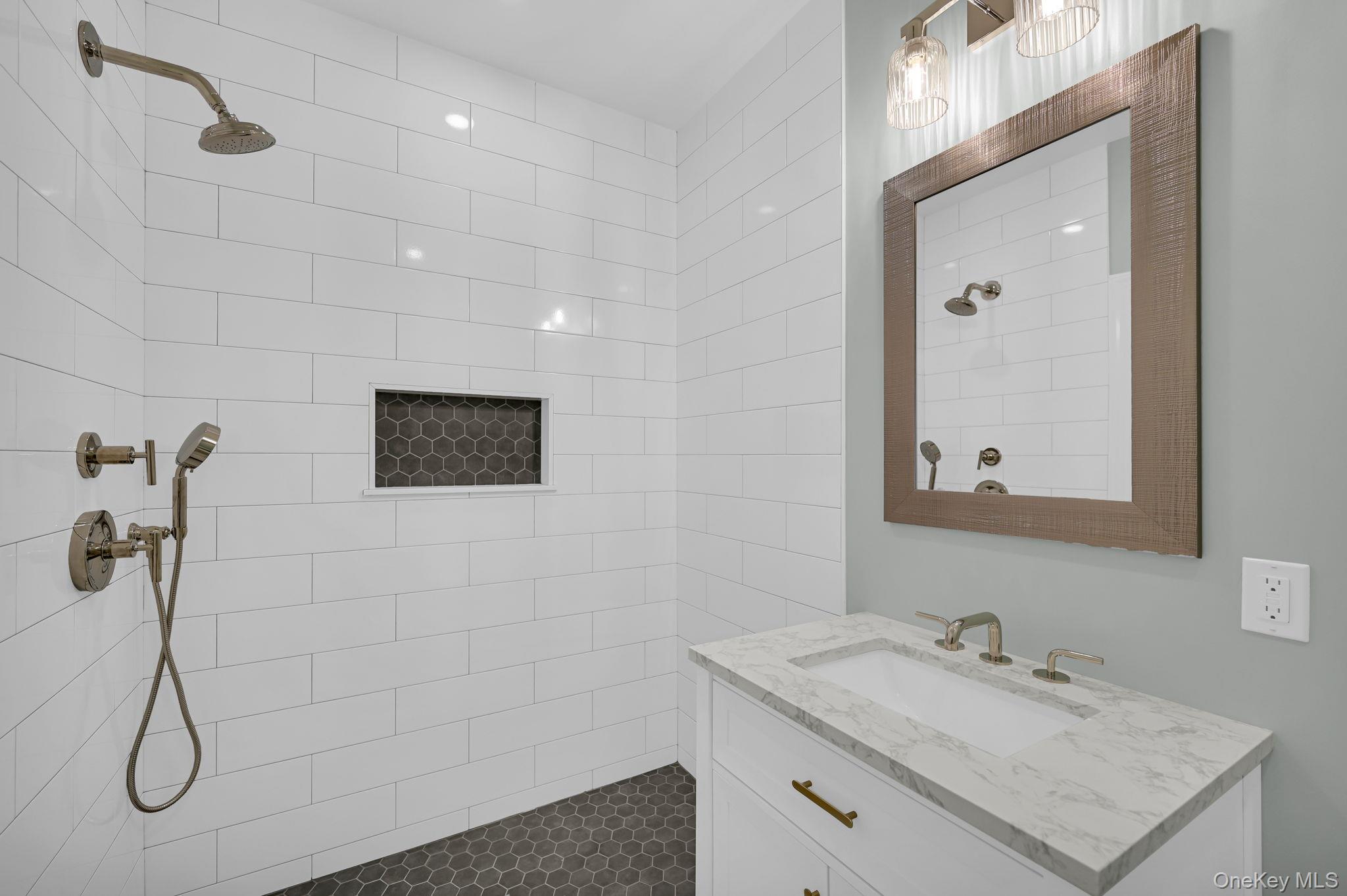 170 Brimstone Road Patterson, NY 12563 - Photo 14 of 48 1st floor Full bathroom featuring tiled shower and vanity
