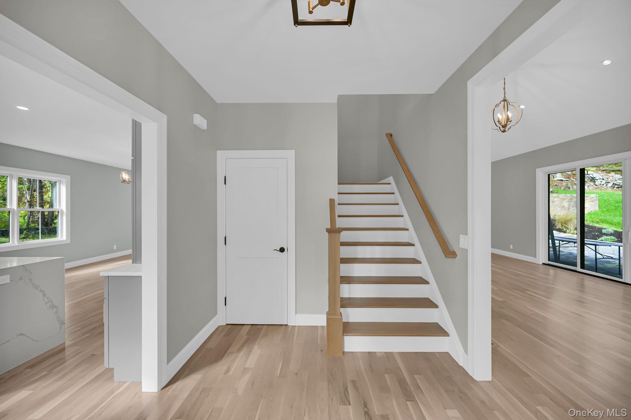 170 Brimstone Road Patterson, NY 12563 - Photo 15 of 48 Stairs featuring a chandelier, wood finished floors