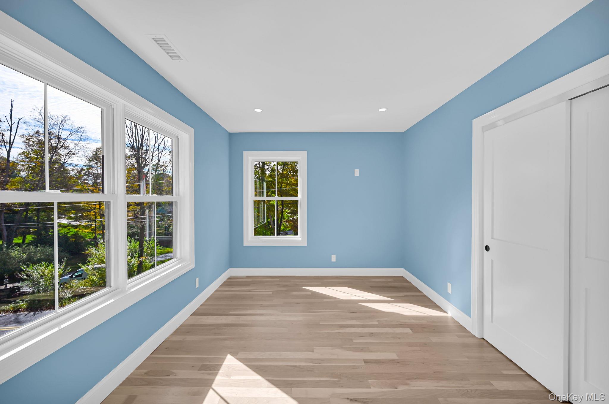 170 Brimstone Road Patterson, NY 12563 - Photo 20 of 48 2nd fl - bedroom1 other view. featuring light wood-style floors, recessed lighting, closet and extra sunny windows