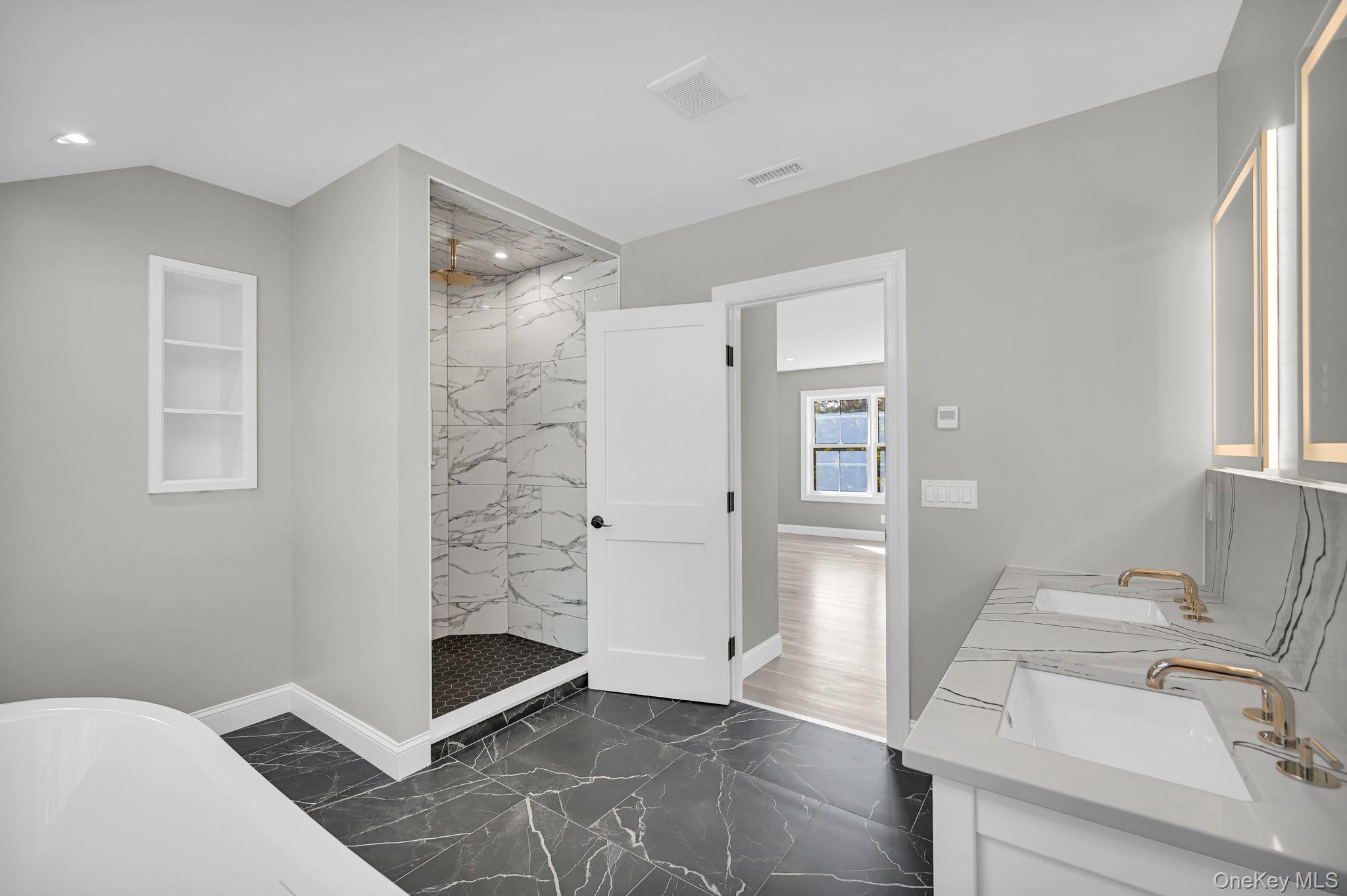 170 Brimstone Road Patterson, NY 12563 - Photo 29 of 48 Bathroom featuring a marble finish shower, a soaking tub, double vanity, and dark marble finish flooring