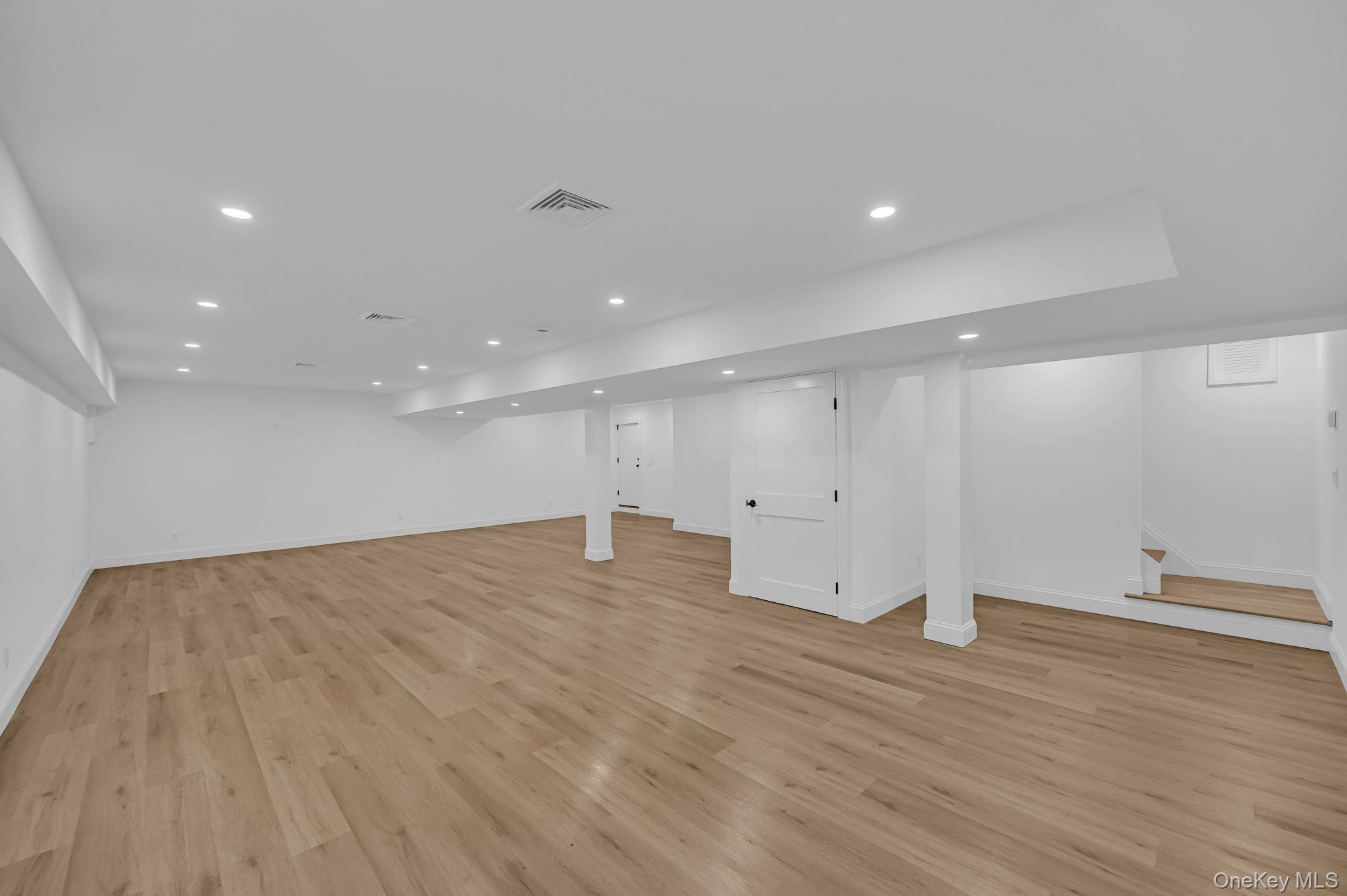 170 Brimstone Road Patterson, NY 12563 - Photo 33 of 48 Finished below grade area with light wood-type flooring, recessed lighting, and stairway and closets