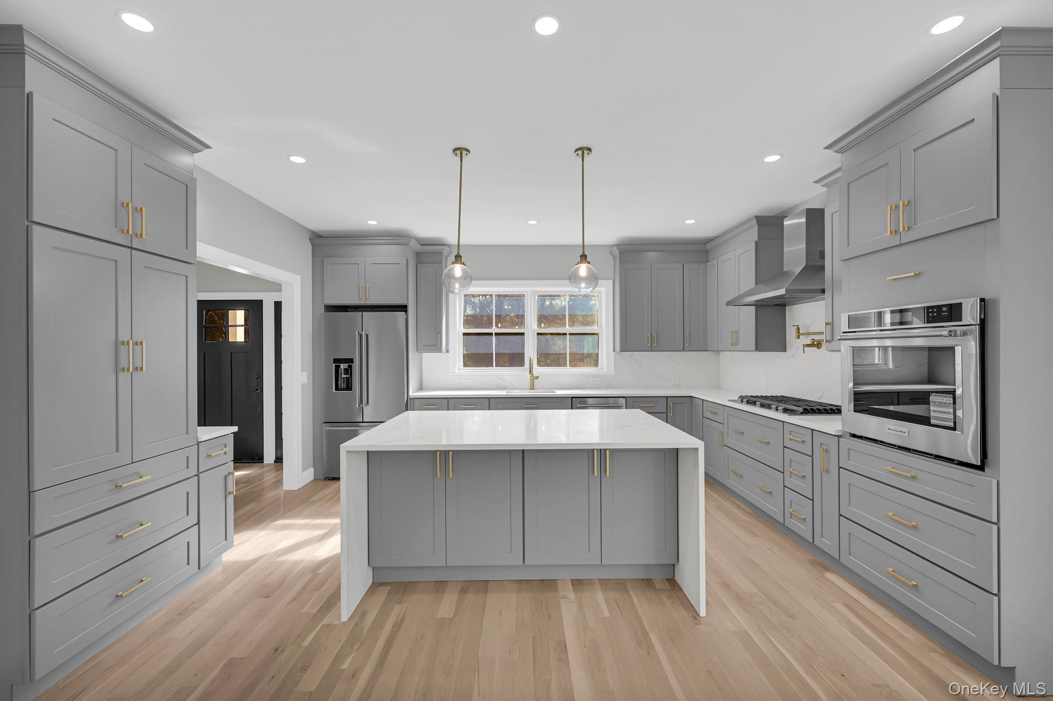 170 Brimstone Road Patterson, NY 12563 - Photo 4 of 48 Kitchen with gray cabinets, pendant lighting, light stone counters, and recessed lighting