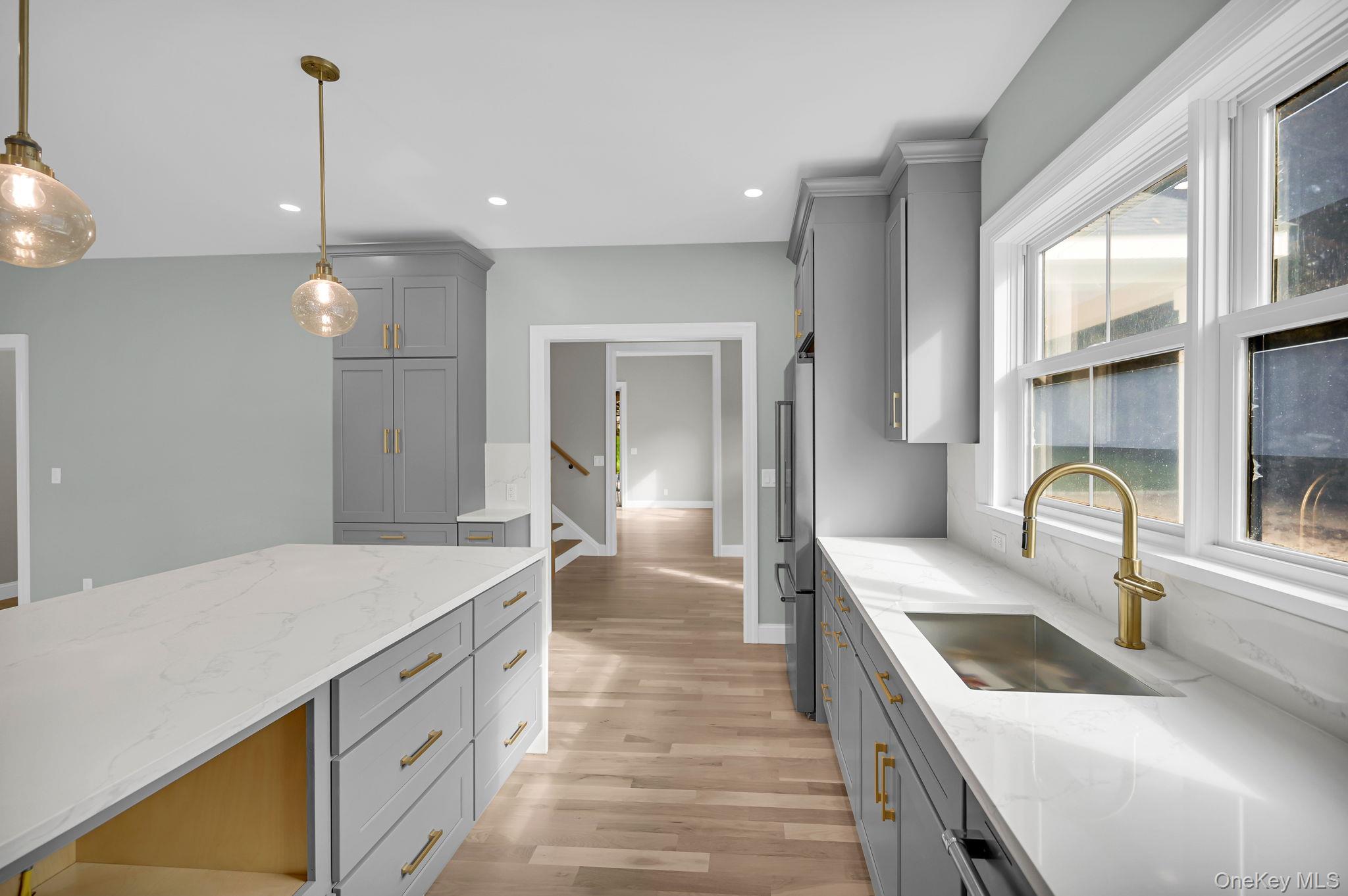 170 Brimstone Road Patterson, NY 12563 - Photo 6 of 48 Kitchen featuring gray cabinets, light stone countertops, light wood-type flooring, pendant lighting, and recessed lighting