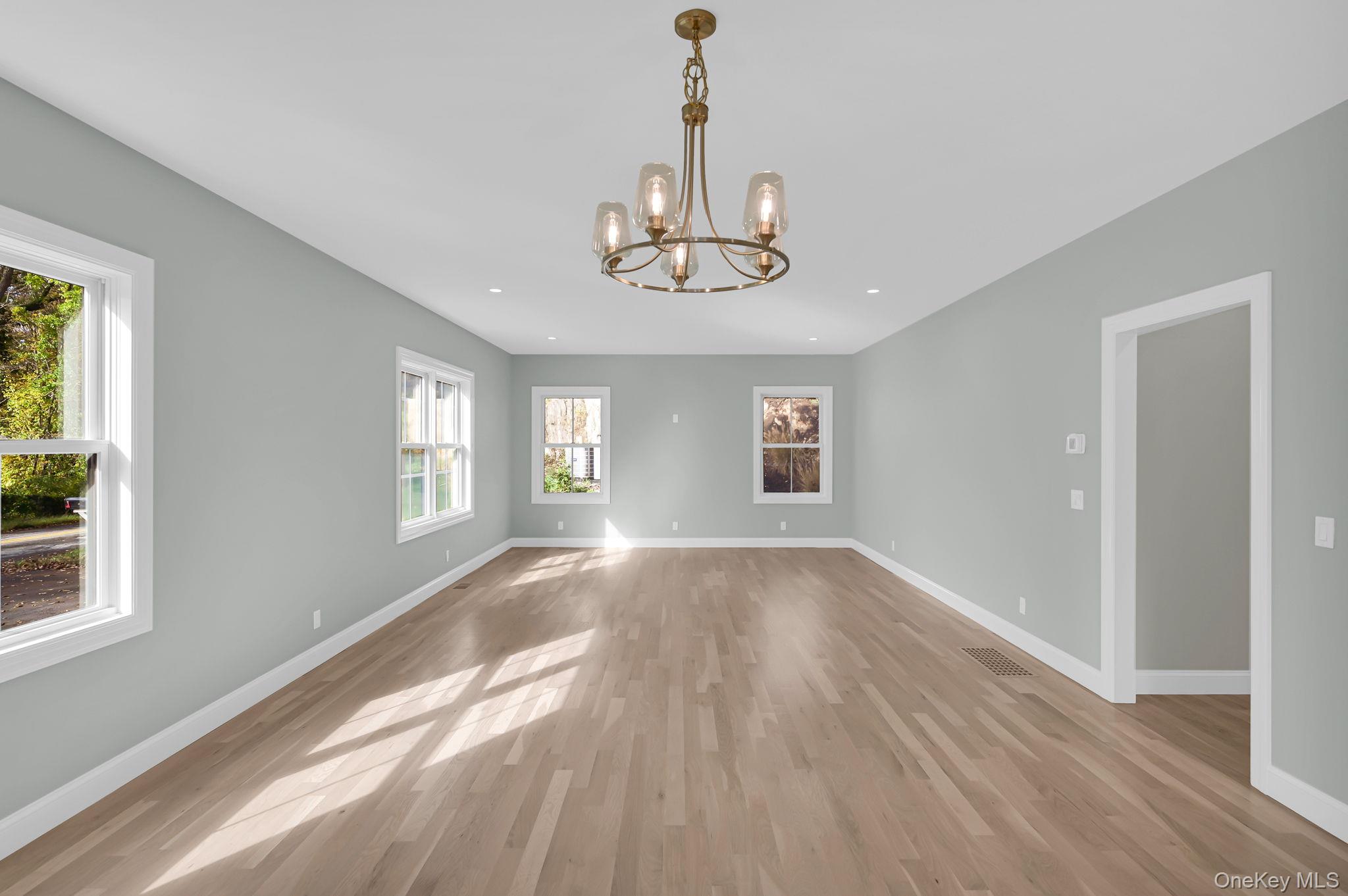 170 Brimstone Road Patterson, NY 12563 - Photo 9 of 48 Unfurnished dining area featuring light wood-style flooring, a chandelier, and recessed lighting