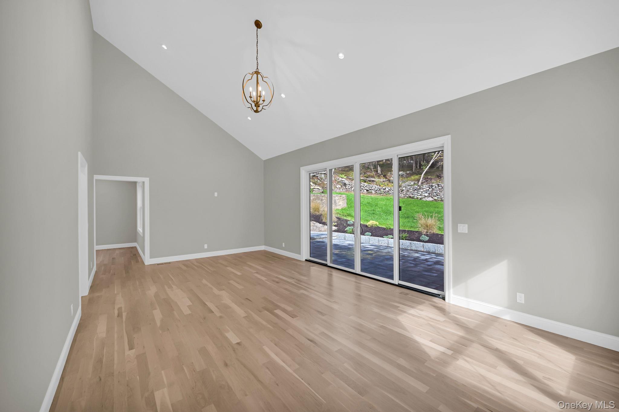 170 Brimstone Road Patterson, NY 12563 - Photo 10 of 48 Family room with sliding doors and cathedral ceiling