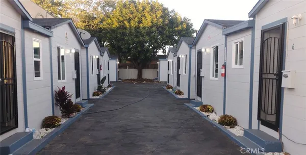 a view of a house with a backyard