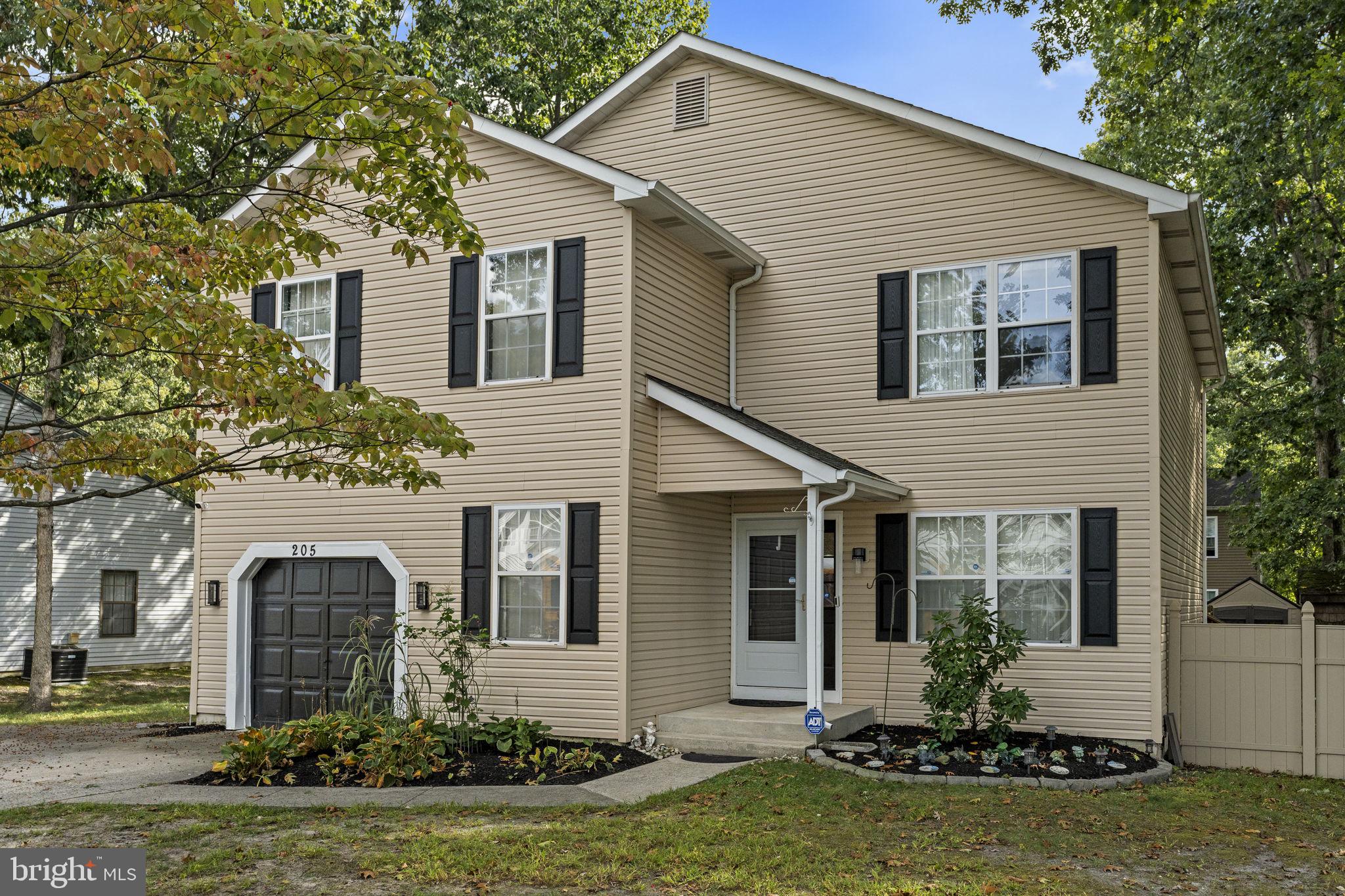 205 Franklin Avenue Berlin, NJ 08009 - Photo 1 of 36 a front view of a house with garden