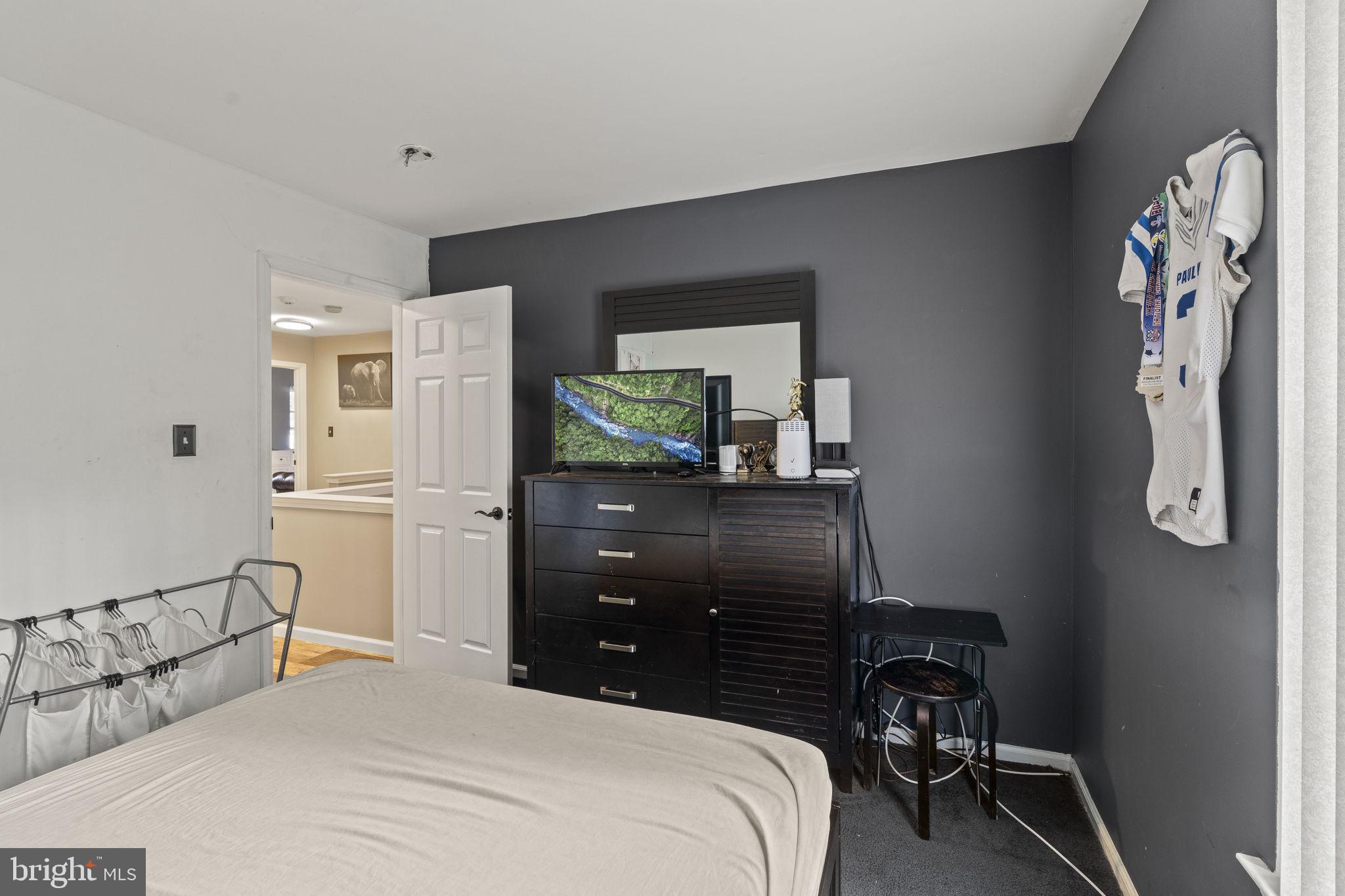 205 Franklin Avenue Berlin, NJ 08009 - Photo 22 of 36 a bedroom with a bed and a dresser