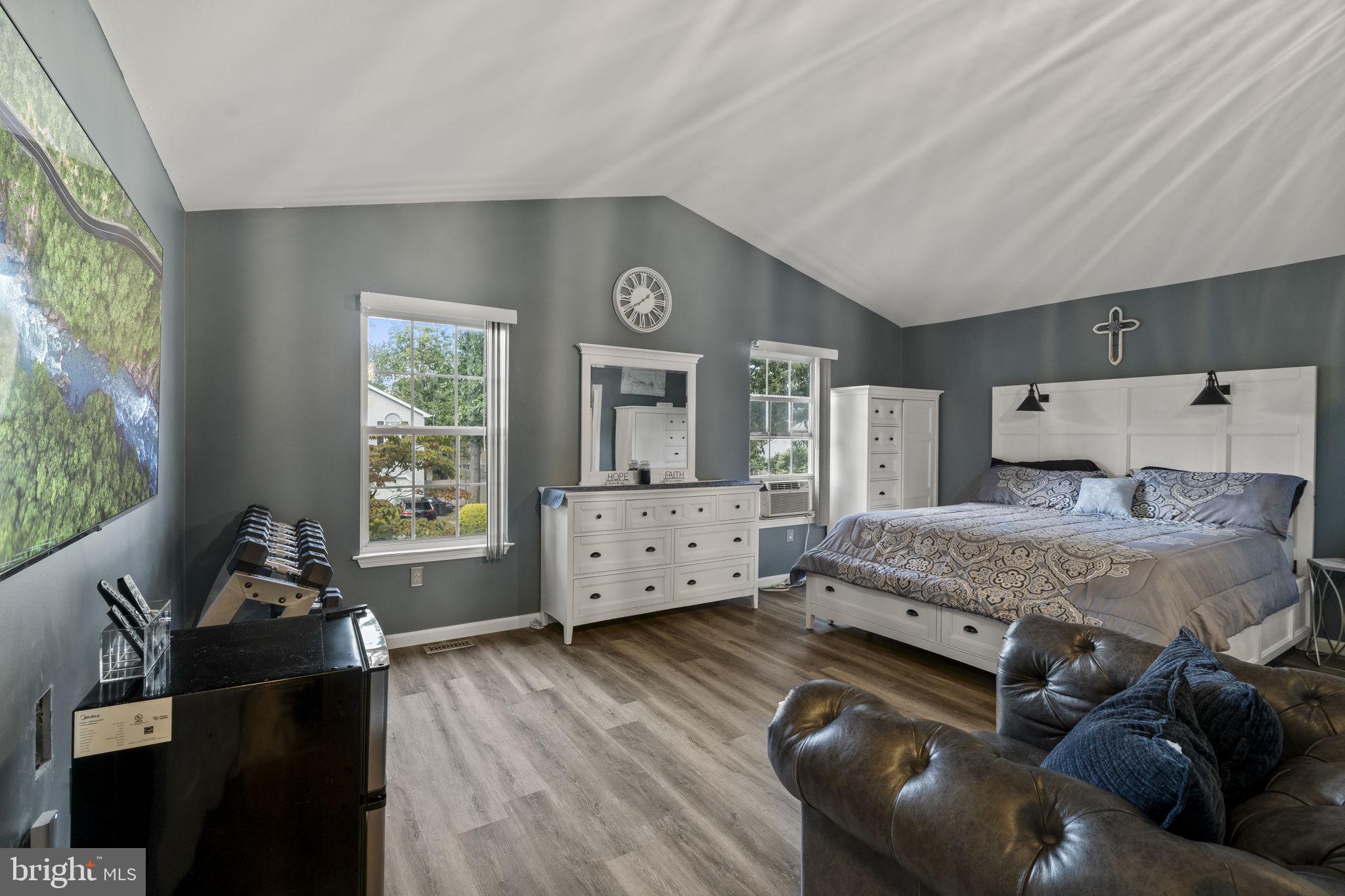205 Franklin Avenue Berlin, NJ 08009 - Photo 25 of 36 a bedroom with a bed and wooden floor