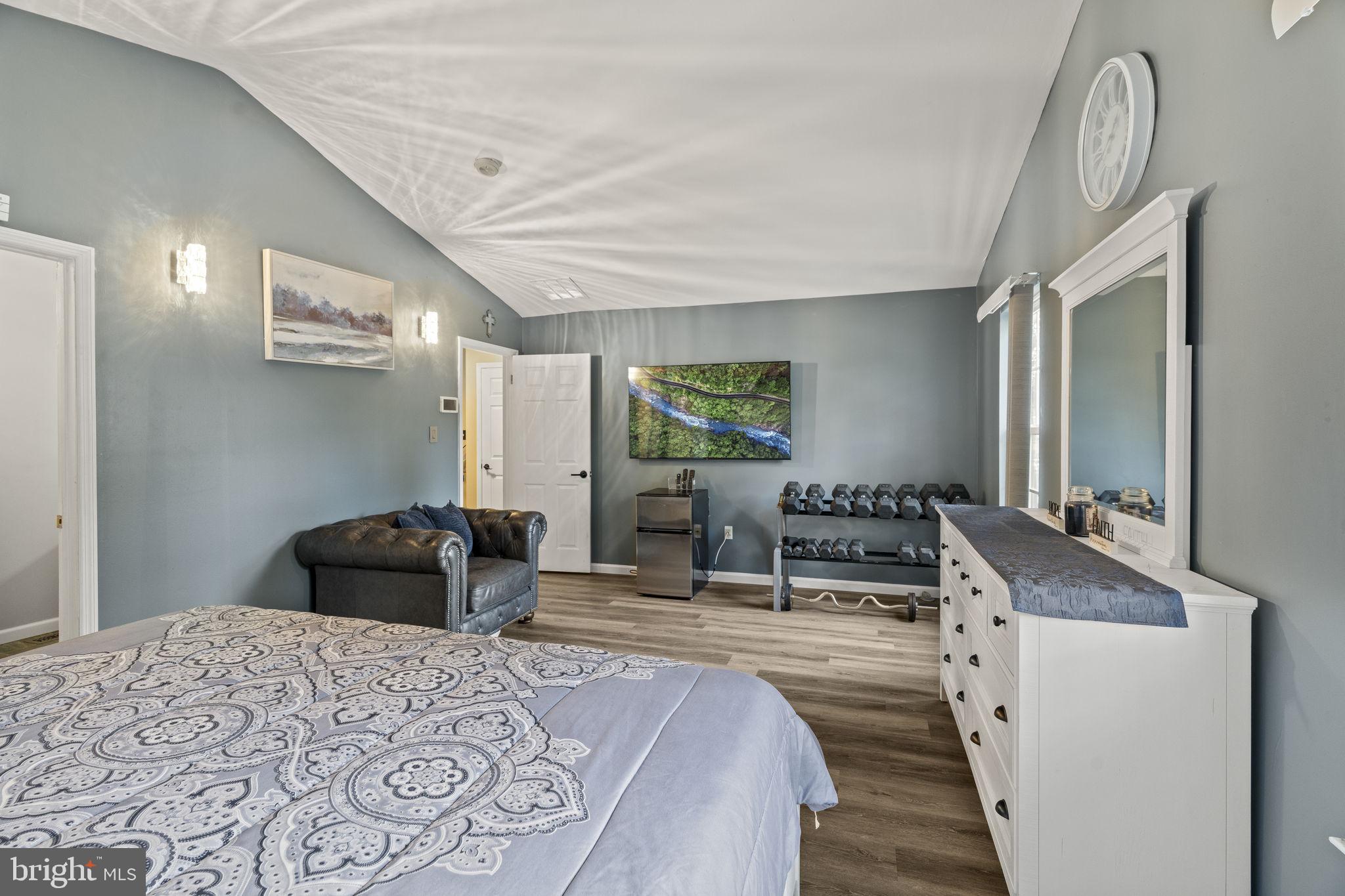 205 Franklin Avenue Berlin, NJ 08009 - Photo 27 of 36 a bedroom with a bed and wooden floor