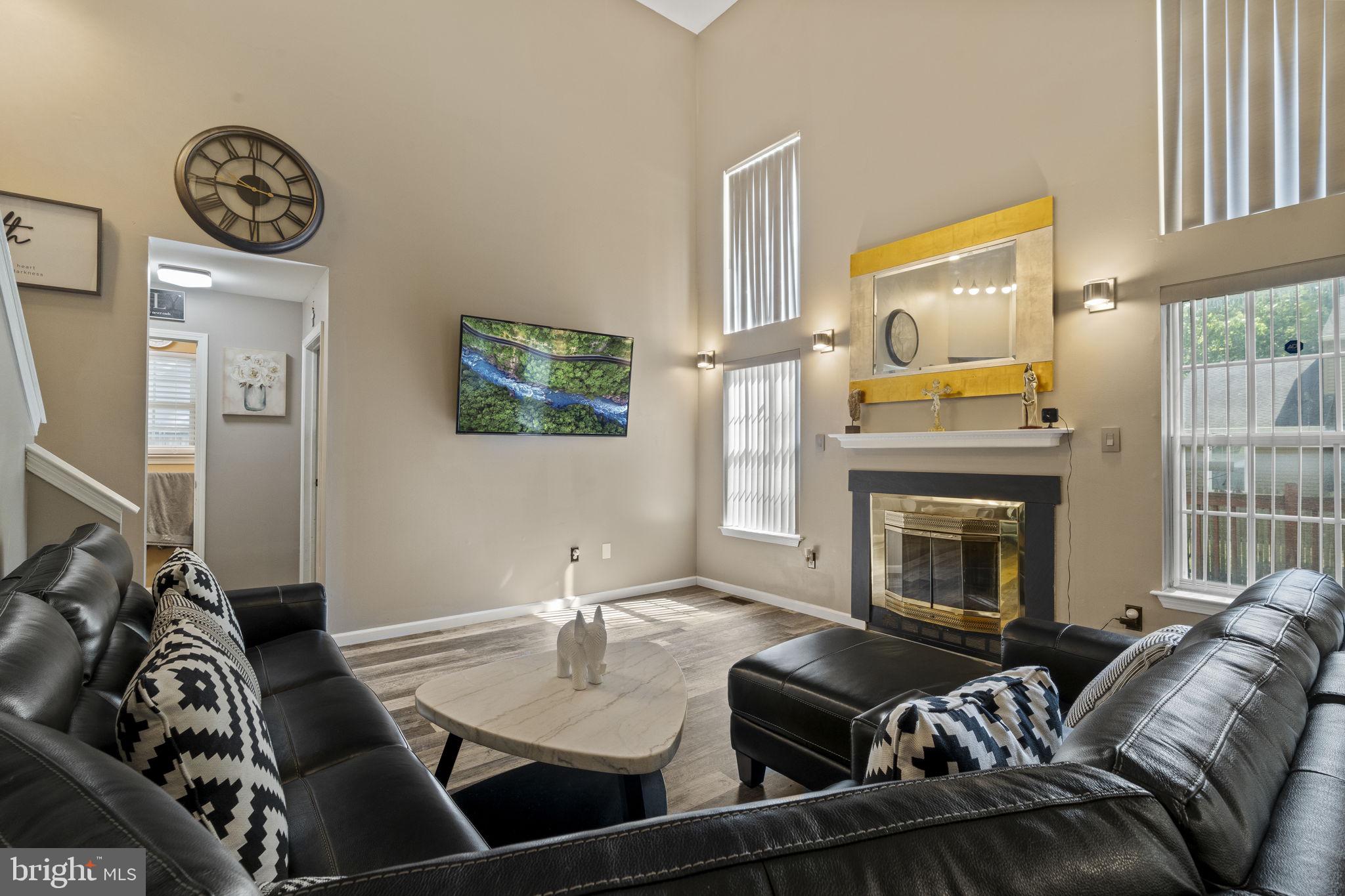205 Franklin Avenue Berlin, NJ 08009 - Photo 6 of 36 a view of a livingroom with furniture and a fireplace