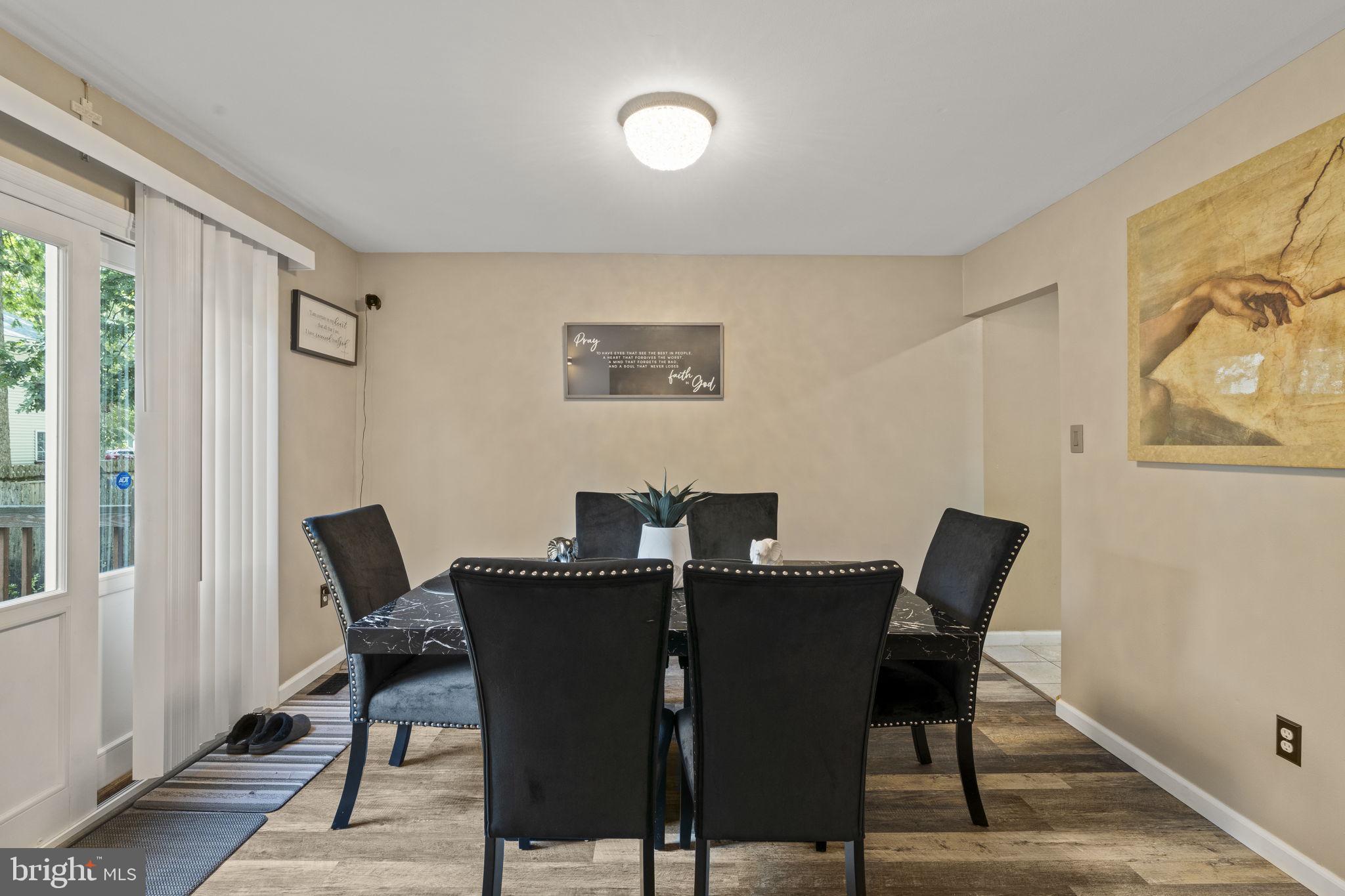 205 Franklin Avenue Berlin, NJ 08009 - Photo 9 of 36 a view of a dining room with furniture and a window