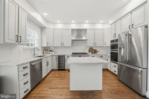 a bedroom with a bed lamp and a large window