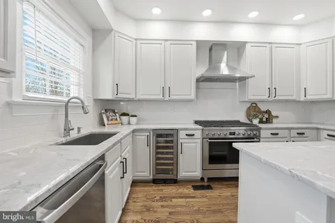 a view of walk in closet with clothes